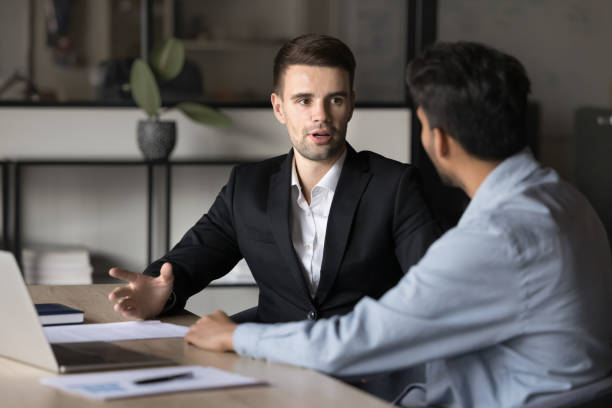 istock Two businessmen discussing deal or project progress, negotiate contract terms 2188689556