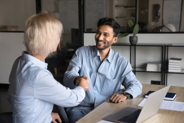istock Two businesspeople sealing agreement, shake hands, conclude profitable deal 2188691135
