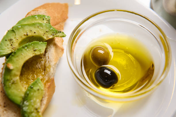 istock Sliced avocado on bread with olive oil and balsamic vinegar dip 2188692194