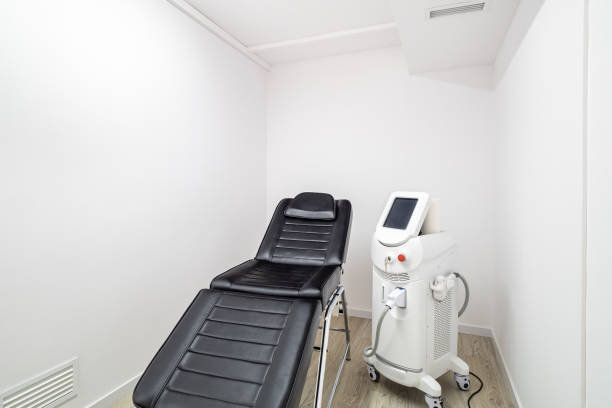 istock Modern empty dermatologist cosmetologist chair and device for beauty procedures. Empty aesthetic medicine salon in a clinic. 2188693105