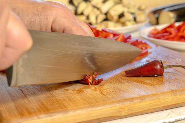Female hands chopping green cabbage