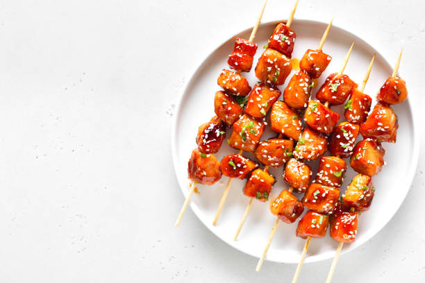 istock Teriyaki chicken skewers on plate 2188698480