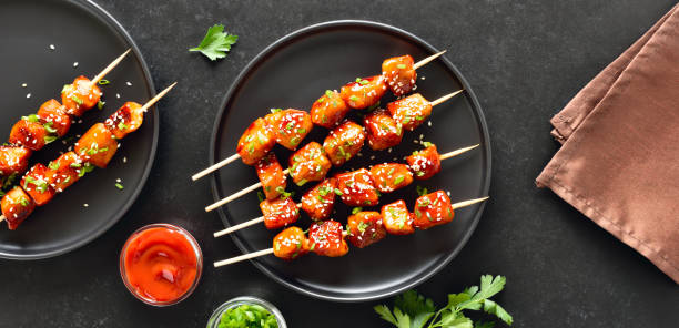istock Teriyaki chicken skewers on plate. 2188699297