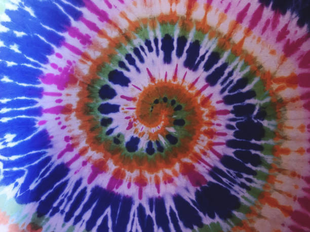 istock Abstract tie-dye pattern of indigo color on white silk. 2188699854