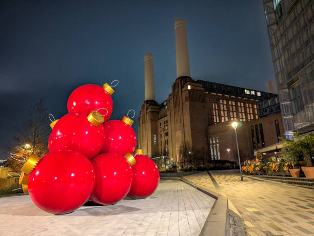 istock Battersea Power Station during nightfall with big red Christmas bubbles in first plan 2188707529