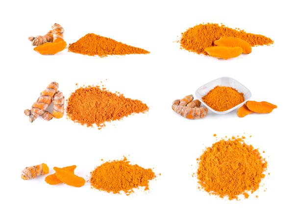 Turmeric roots and turmeric powder on white background