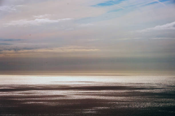 istock A cloudy sky with a large body of water 2188711783