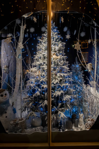 istock Decorative Christmas Tree in a shop window 2188712188