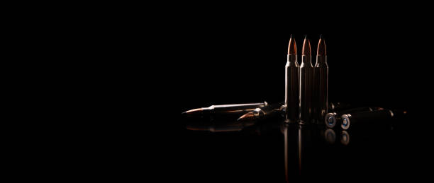 Bullet isolated on black background with reflexion. Rifle bullets close-up on black back. Cartridges for rifle and carbine on a black.