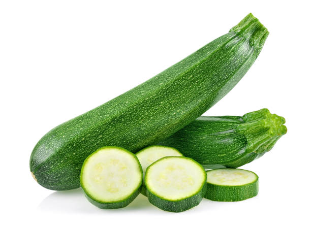 istock fresh green zucchini with slice isolated on white background. 2188716373