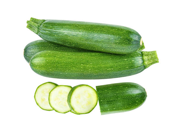 istock fresh green zucchini with slice isolated on white background. 2188721306