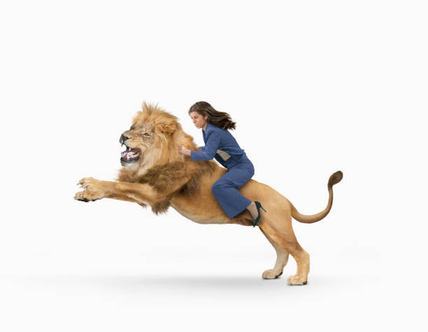 istock Woman rides lion 2188721784