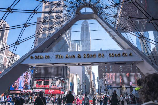 New York, New York, USA  October 27, 2024: Commuters enter and exit at the Eighth avenue entrance to Penn Station in New York, New York, USA.