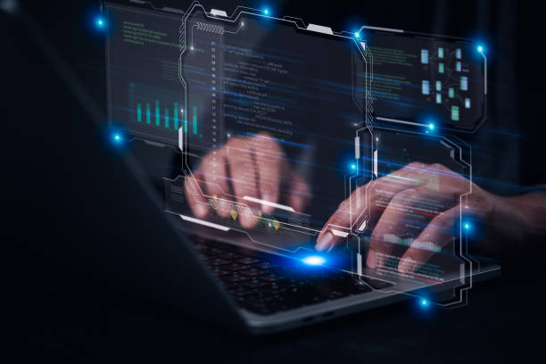Hands typing on laptop with programming code on screen, software development. coding, IT solutions, digital technology, web applications javascript on virtual screen, internet of things IoT stock photo