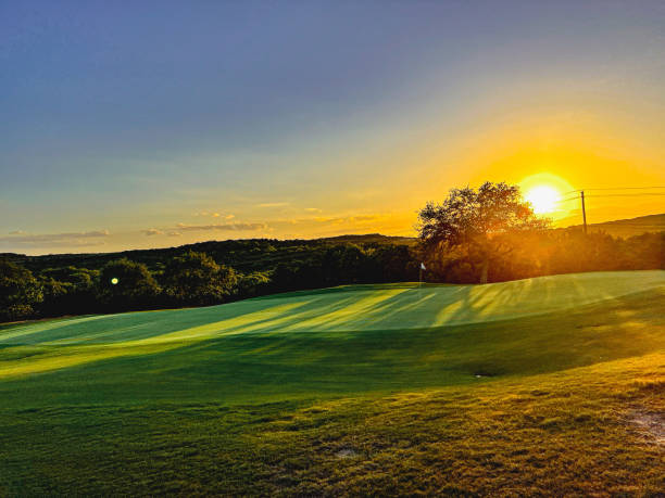 istock Scenic Golf Course at Sunrise with Rolling Hills and Golden Sky 2188737091