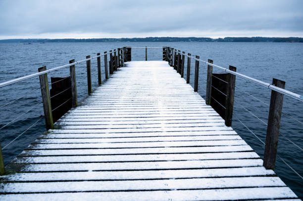 istock Snow-covered pier on the Baltic Sea 2188738990