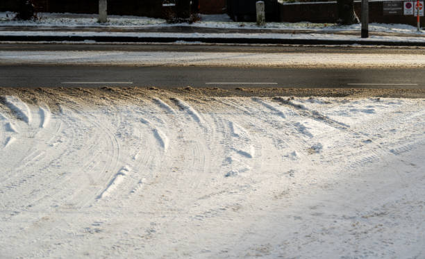 istock Tire tracks on a snowy road 2188739004