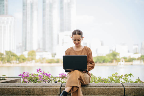 istock Businesswoman using smart phone in City 2188739715