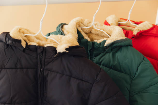 istock Winter jackets hanging on rack, showing warm lining 2188741473