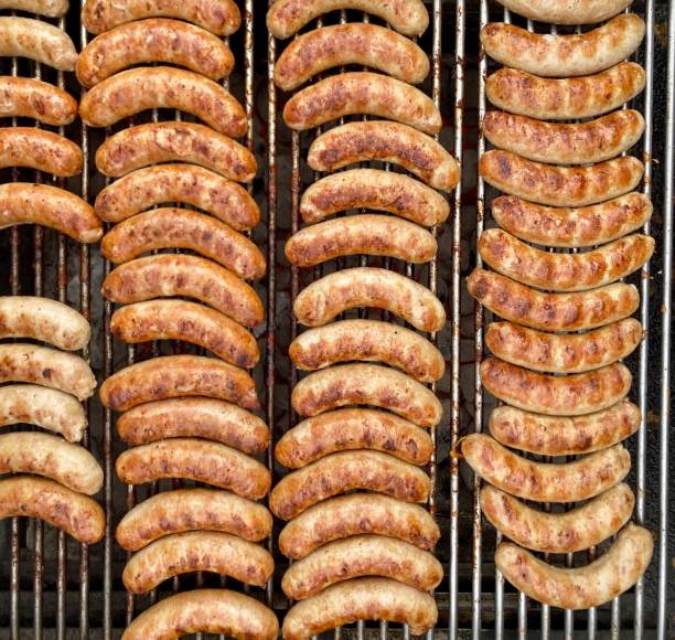 closeup of sausages on the barbecue in the street