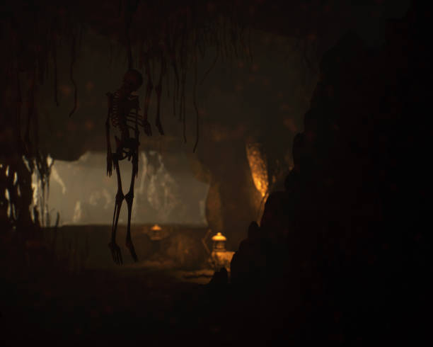 istock Skulls and bones in an ancient dark mysterious fantasy cave. 3D render. 2188745347