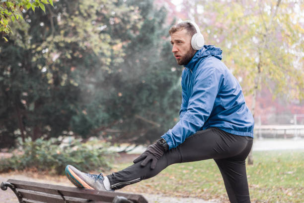 istock Runner Stretching in Foggy Park 2188749431