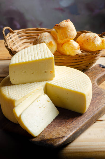 istock Cheese and cheese bread, a beautiful breakfast table with Brazilian delicacies and accessories on rustic wood, selective focus. 2188751233