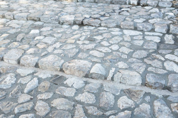 istock Rustic Stone Pathway with Textured Cobblestones. Perfect for capturing the charm of traditional architecture and old-world craftsmanship 2188752098