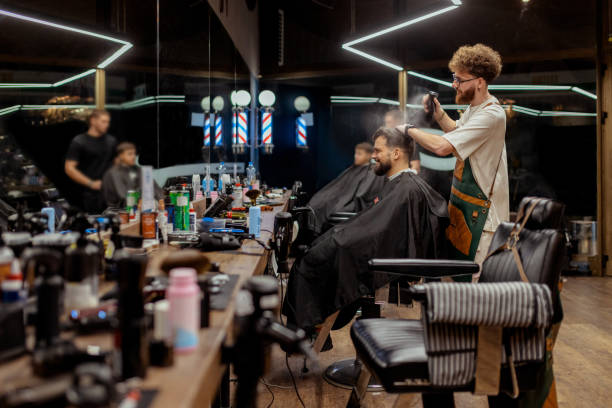 istock Barber in Action Preparing Client for Trendy Haircut 2188752448