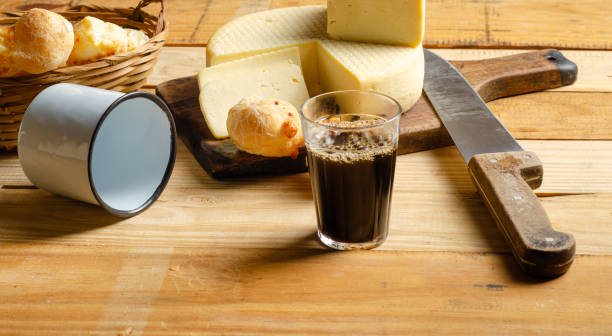istock Cheese and cheese bread, a beautiful breakfast table with Brazilian delicacies and accessories on rustic wood, selective focus. 2188752547