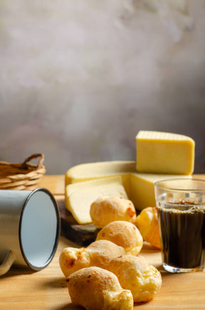 istock Cheese and cheese bread, a beautiful breakfast table with Brazilian delicacies and accessories on rustic wood, selective focus. 2188752932
