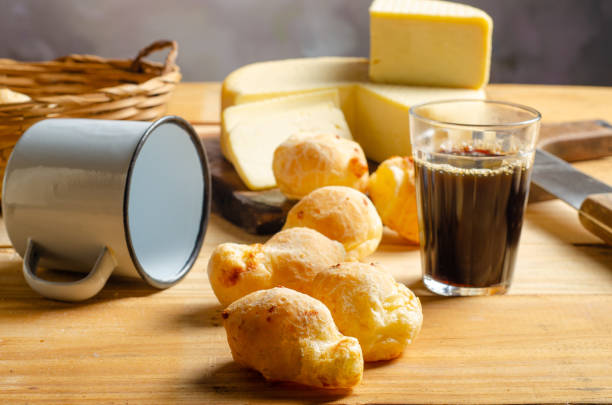 istock Cheese and cheese bread, a beautiful breakfast table with Brazilian delicacies and accessories on rustic wood, selective focus. 2188752971