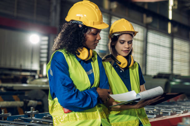 istock Foreman or worker work at factory site check up machine or products in site. 2188757304