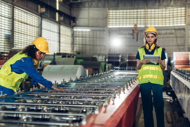 istock Foreman or worker work at factory site check up machine or products in site. 2188757345