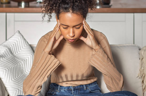 istock Stressed Woman Holding Head from Headache 2188758078