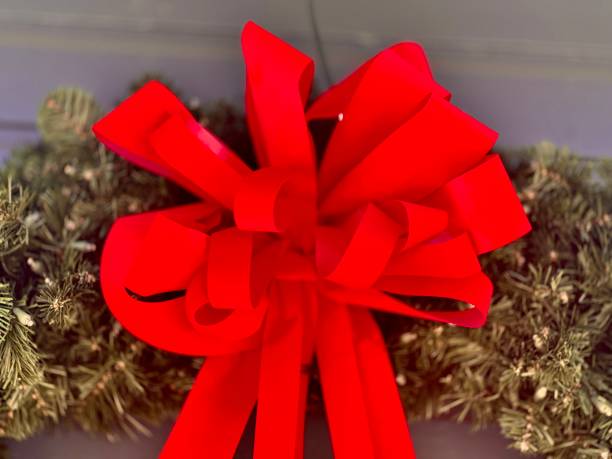 istock Closeup of red bow on wreath. 2188759380
