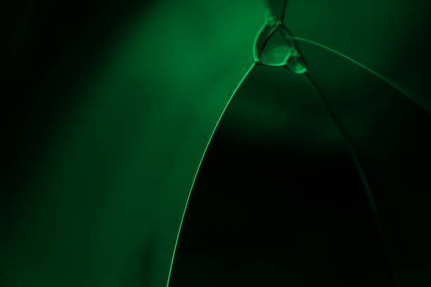 Green fluid reflections on black background, liquid abstraction, colour waves, deep dark backgrounds, geometric water shapes, fluids surface movement, illuminated shapes
