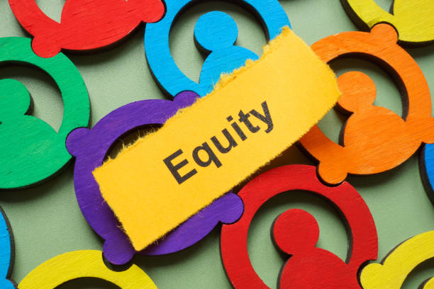 istock Colorful figures and word equity. Diversity and social fairness. 2188765984