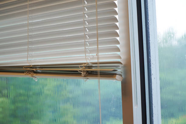 istock close up on curtain and glass window with rain exterior 2188772601