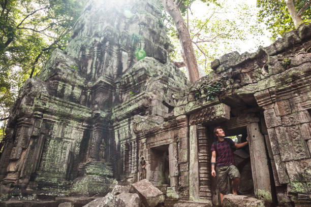 istock Exploring the ancient ruins of Angkor Wat in Cambodia amidst lush greenery 2188774247