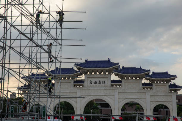 On OCT 14th 2024, in Taipei city, Taiwan, Construction workers work on scaffolding at Liberty Square in Taipei City, many of whom are foreign workers from Southeast Asian countries. Taiwan has become the preferred destination for many South Asian and Southeast Asian husbands due to its developed economy and convenient transportation.