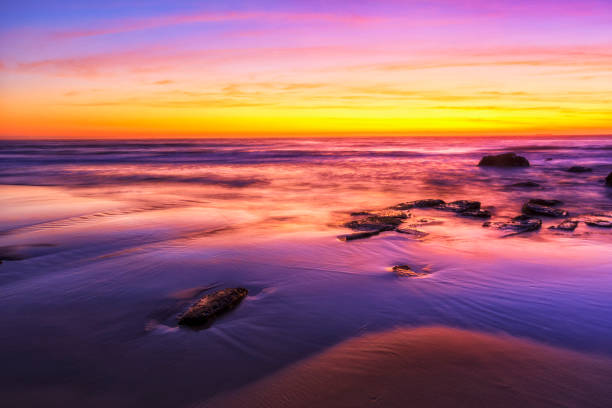 istock Caves beach rise to sun 2188781205