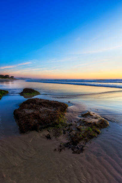 istock Caves beach blue to north vert 2188781266