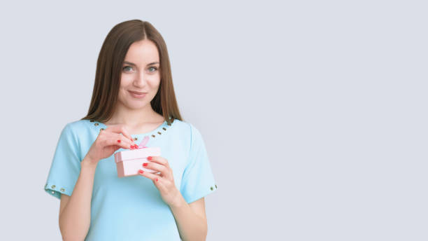 istock Party fun festive joy smiling happy woman present 2188788839