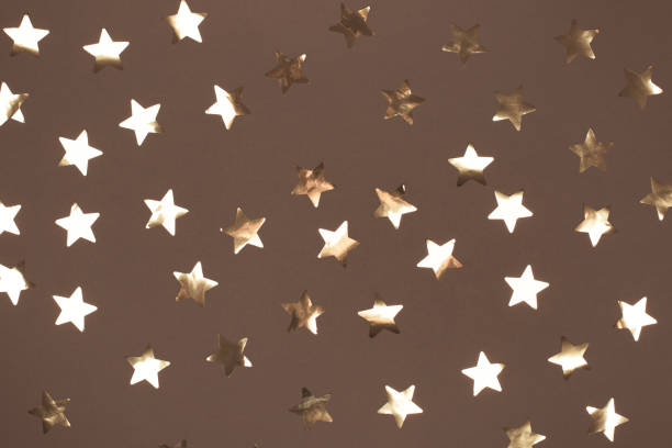 istock Golden star pattern on a mocha and mousse background for festive decor 2188790838