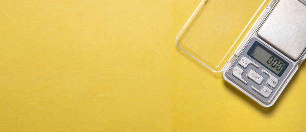 istock Digital scale of gold on yellow background. 2188792977