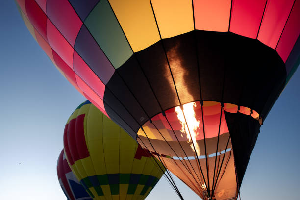 istock Hot air balloons lift off into the dawn sky 2188793675