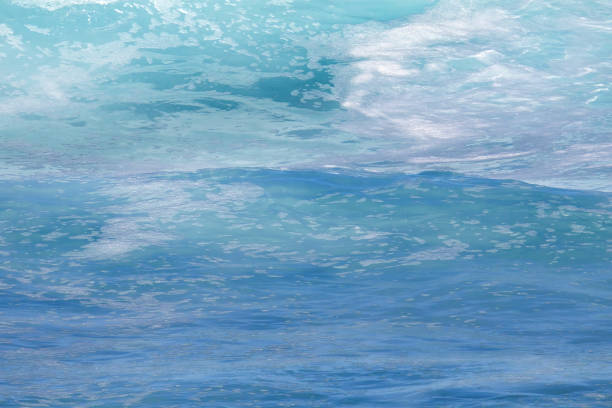 istock Extreme close-up of a blue green ocean wave exploding as it breaks. 2188800651