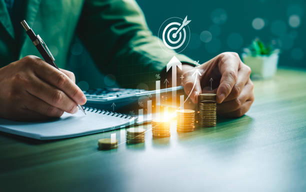 istock Business Financial Growth Strategy with Rising Bar Graphs, Target Symbol, Stacked Coins, Depicting Investment Success and Profit Planning, Investment Strategies, Budgeting, and Economic Forecasting 2188803365