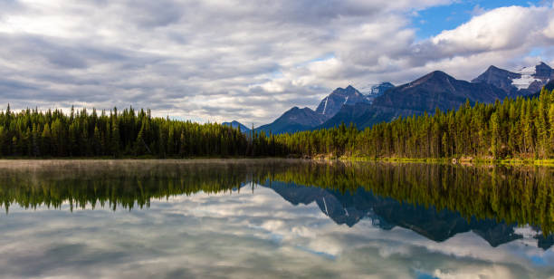 istock Scenic Mountain Landscape Reflecting on Tranquil Lake Surface 2188805886